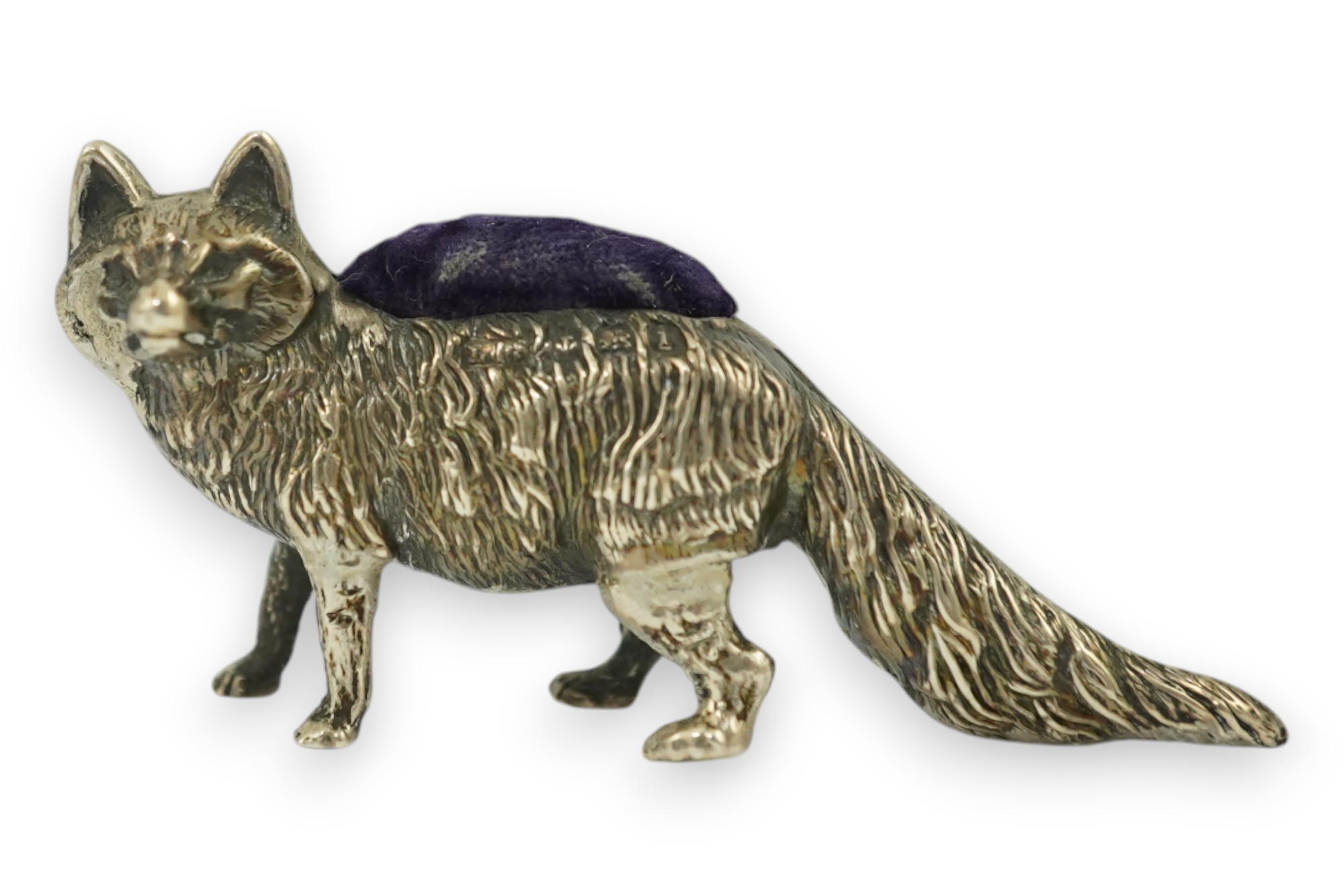 An Edwardian novelty silver mounted pin cushion, modelled as a fox, Levy & Salaman, Birmingham, 1908, length 57mm. Condition - fair to good